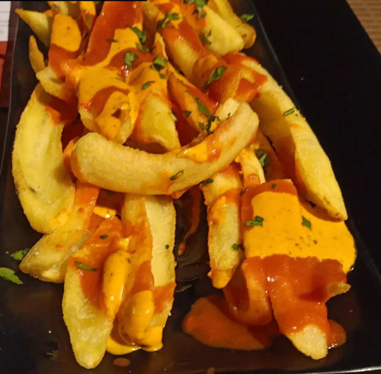 Foto de las bravas: DANDO CAÑA GASTRO-BAR.
